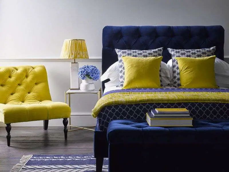 Navy blue and yellow bedroom
