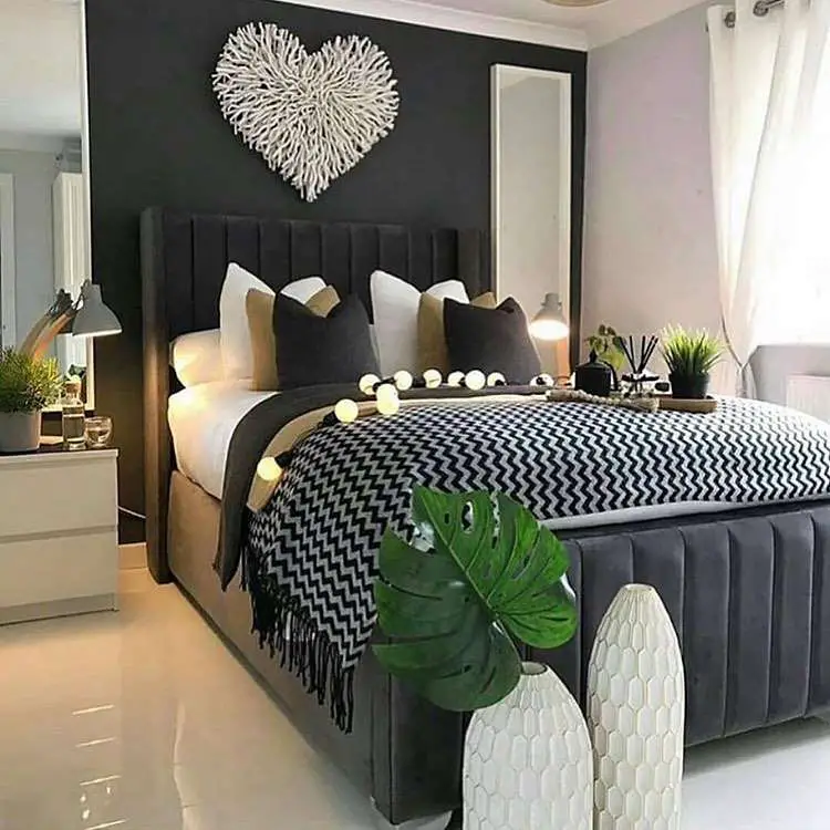 white bedroom with black accent wall